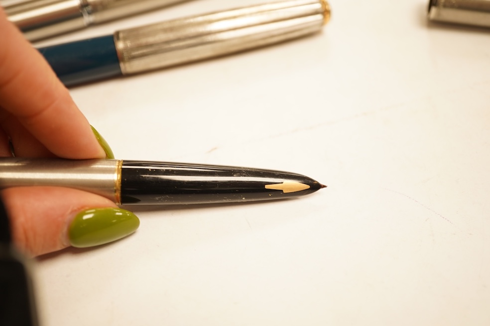A Sheaffer 'White Spot' fountain pen with 14K gold nib and chevron decoration and three other pens